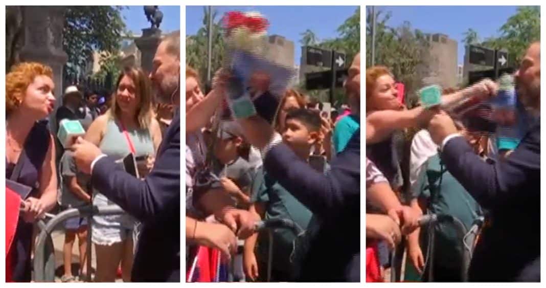 ¡Impactante agresión en vivo! Mujer golpea a Neme con foto de Piñera
